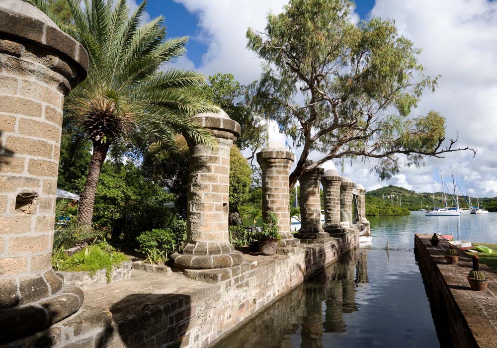 antigua-gallery6 Old stone ruins with tropical plants by the water