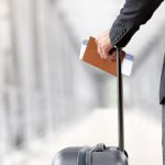 A visitor carries their travel documents