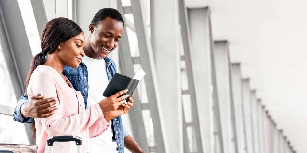 A couple enjoy the benefits of their Dominica passports